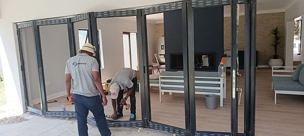 Charcoal Aluminium folding door repaired by Sigmadoors glass door repairs in Blue Valley Golf Estate Centurion